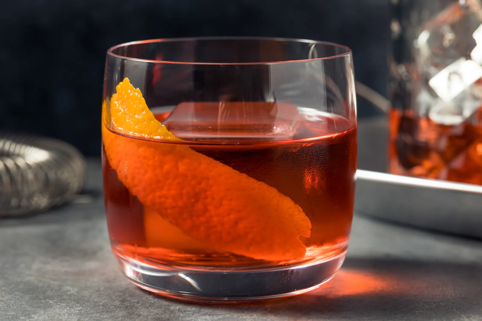 A Negroni on the bar in low evening light
