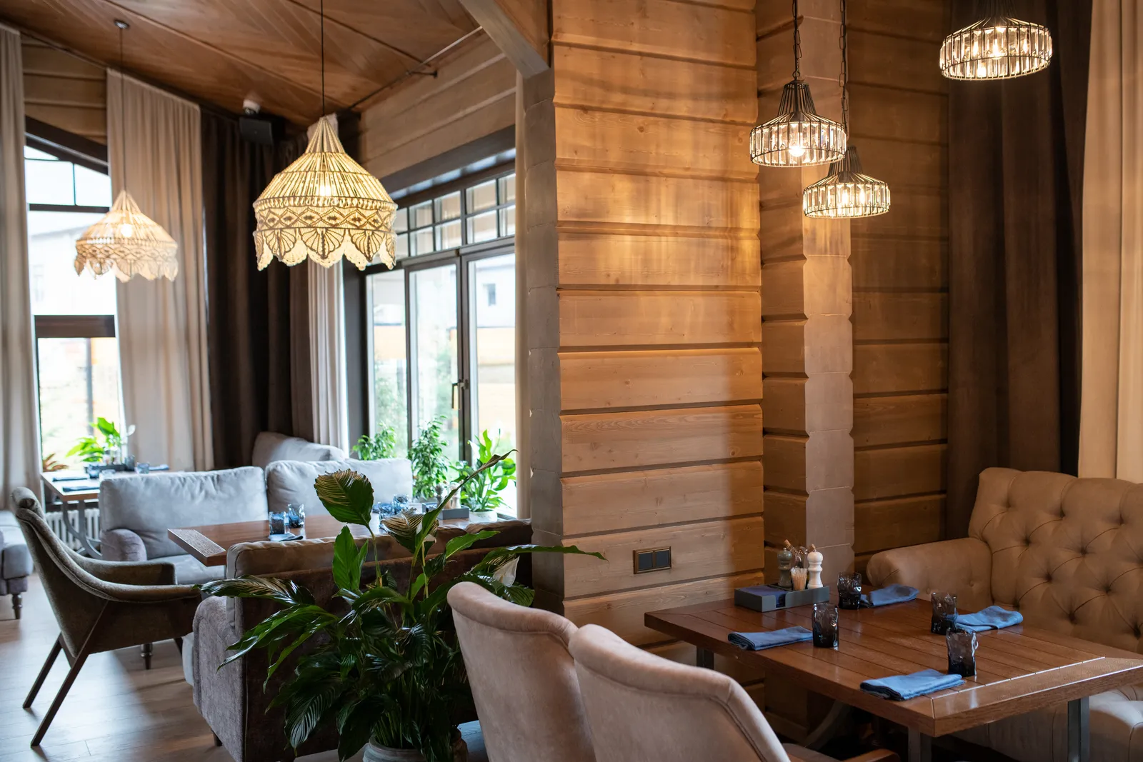 The Olden dining room with warm lighting and wooden tables